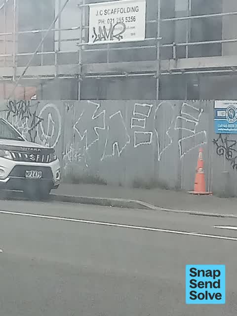 Graffiti on a fence, building or structure, a report photo