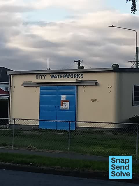 Graffiti on a traffic light pole or cabinet, or wa — a report photo