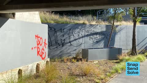 Graffiti on a road, footpath or bridge — a report photo