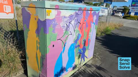 Graffiti on a traffic light pole or cabinet, or wa — a report photo