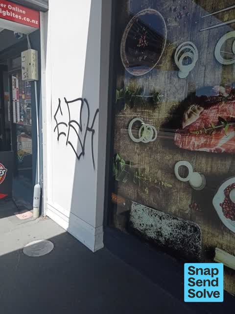 Graffiti on a fence, building or structure, a report photo