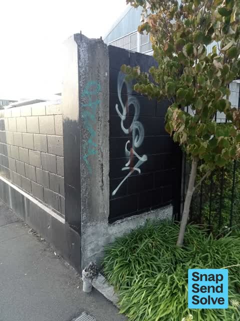 Graffiti on a fence, building or structure — a report photo