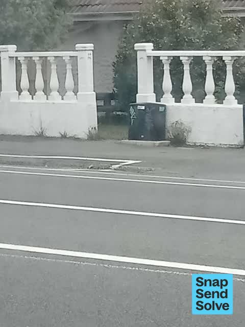 Graffiti on a traffic light pole or cabinet, or wa — a report photo
