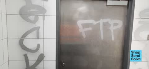 Graffiti on a bus stop or public toilet — a report photo