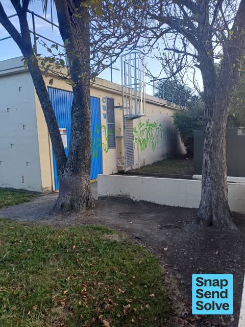 Graffiti on a fence, building or structure, a report photo