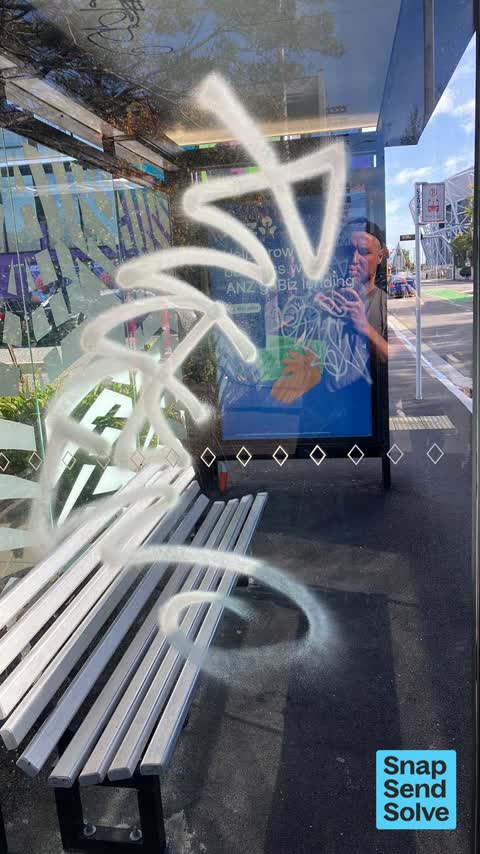 Graffiti on a bus stop or public toilet, a report photo