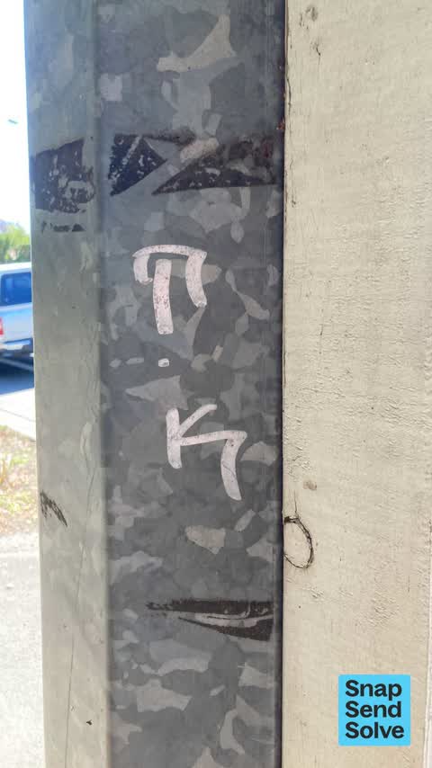 Graffiti on a fence, building or structure, a report photo