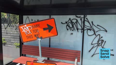 Graffiti on a bus stop or public toilet, a report photo