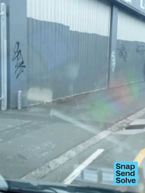 Graffiti on a fence, building or structure — a report photo