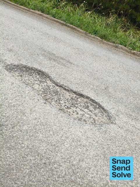 Pothole, a report photo