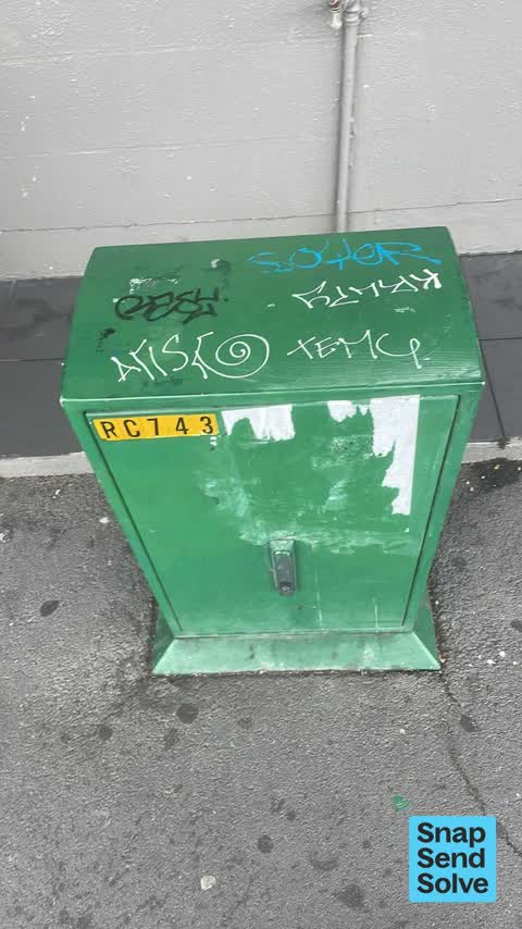 Graffiti on a traffic light pole or cabinet, or wa, a report photo