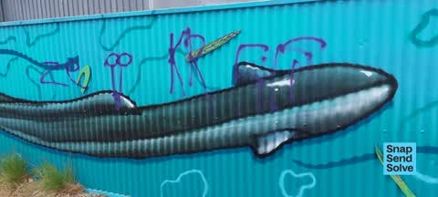 Graffiti on a sign, mural or public art, a report photo