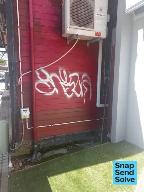 Graffiti on a fence, building or structure, a report photo