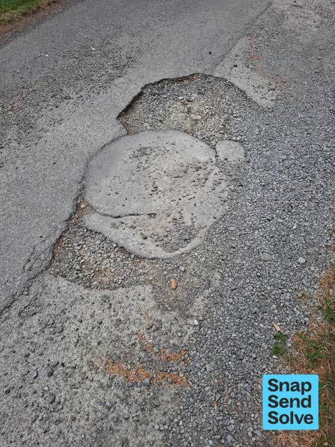 Pothole — a report photo