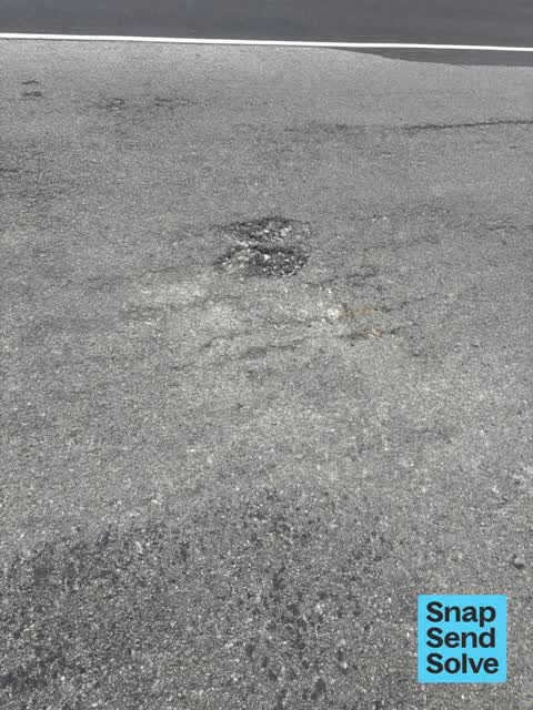 Pothole, a report photo