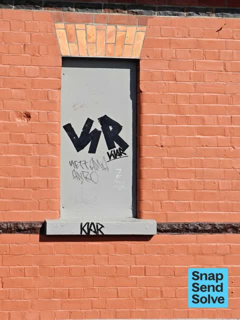 Graffiti on a fence, building or structure — a report photo