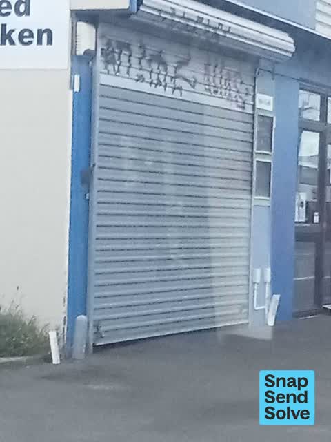 Graffiti on a fence, building or structure, a report photo
