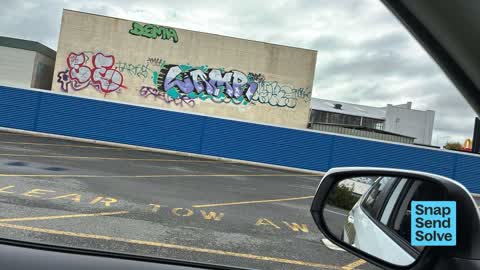 Graffiti on a fence, building or structure, a report photo