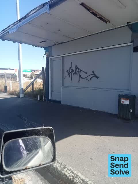 Graffiti on a fence, building or structure, a report photo