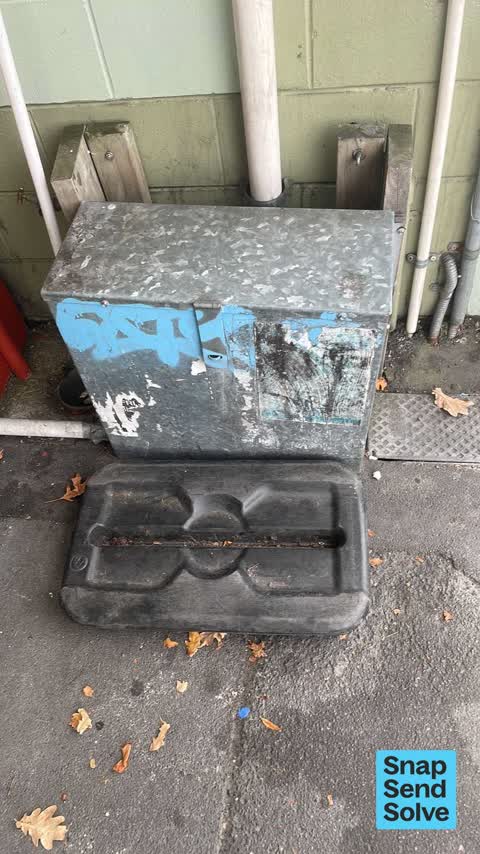 Graffiti on a traffic light pole or cabinet, or wa, a report photo