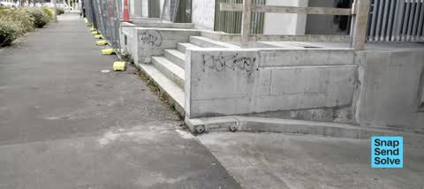 Graffiti on a fence, building or structure, a report photo