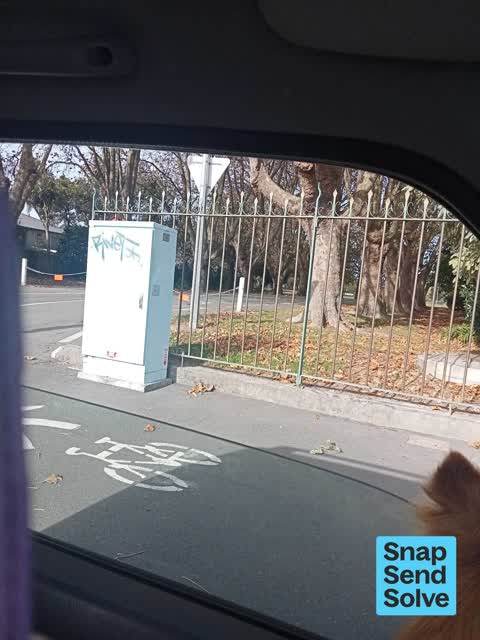 Graffiti on a traffic light pole or cabinet, or wa — a report photo