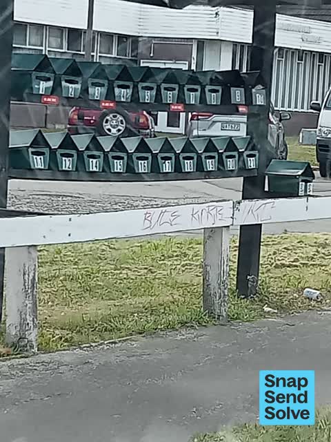 Graffiti on a fence, building or structure, a report photo