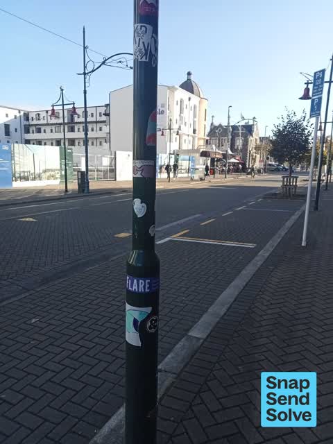 Graffiti on a traffic light pole or cabinet, or wa — a report photo