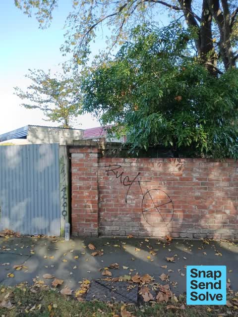 Graffiti on a fence, building or structure, a report photo