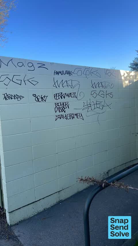 Graffiti on a fence, building or structure, a report photo
