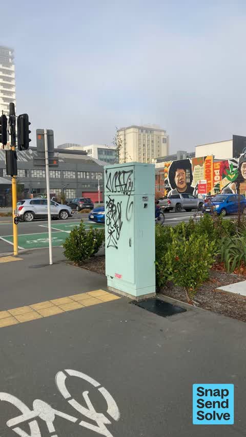 Graffiti on a traffic light pole or cabinet, or wa — a report photo