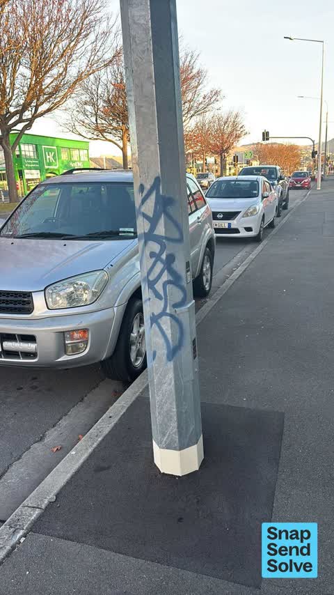 Graffiti on a traffic light pole or cabinet, or wa, a report photo