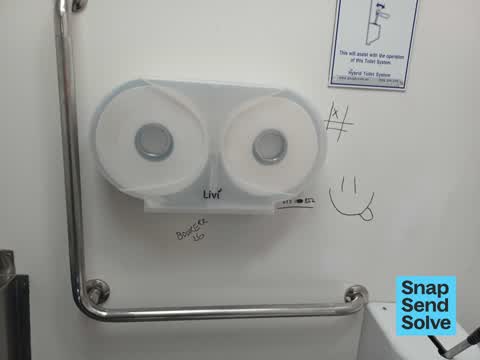 Graffiti on a bus stop or public toilet, a report photo