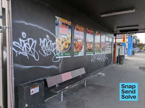 Graffiti on a fence, building or structure, a report photo