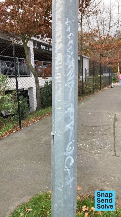 Graffiti on a fence, building or structure, a report photo