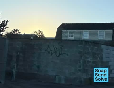 Graffiti on a fence, building or structure, a report photo