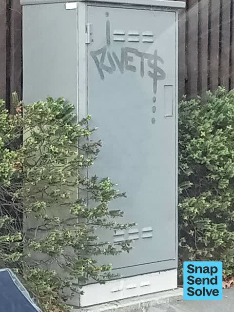 Graffiti on a traffic light pole or cabinet, or wa, a report photo