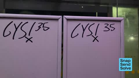 Graffiti on a bus stop or public toilet, a report photo