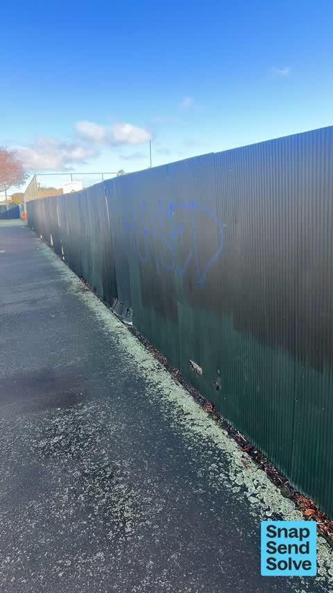 Graffiti on a fence, building or structure, a report photo