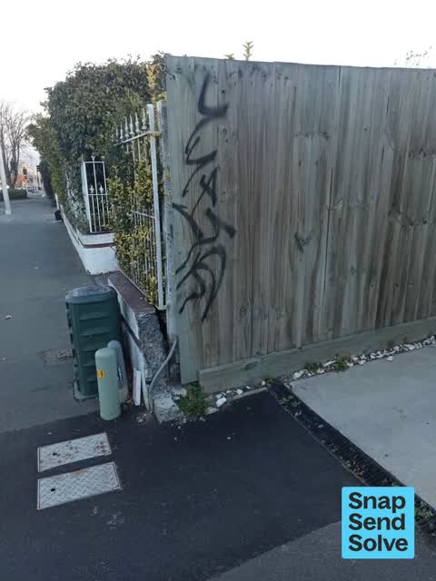 Graffiti on a fence, building or structure, a report photo
