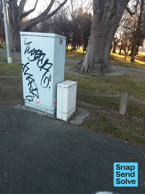 Graffiti on a traffic light pole or cabinet, or wa — a report photo