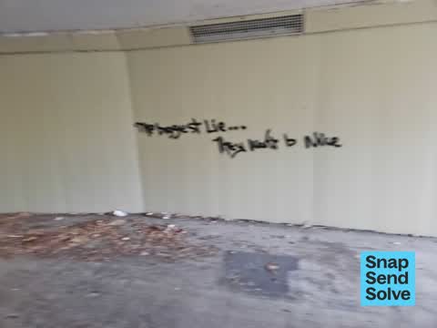 Graffiti on a fence, building or structure, a report photo