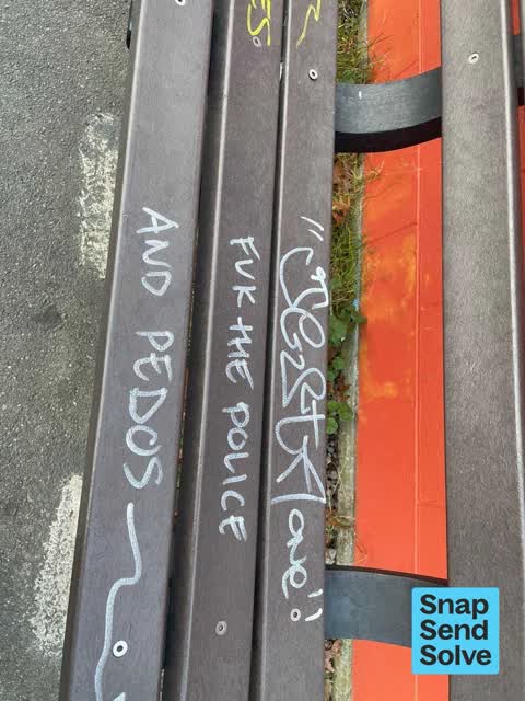 Graffiti on a bus stop or public toilet, a report photo