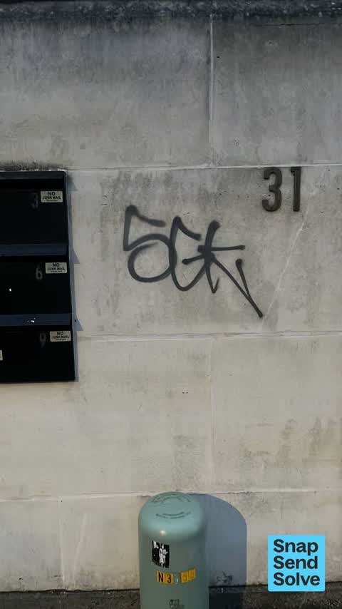 Graffiti on a fence, building or structure, a report photo