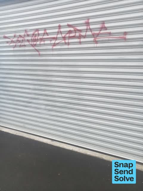 Graffiti on a fence, building or structure, a report photo