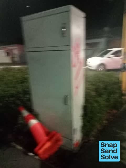 Graffiti on a traffic light pole or cabinet, or wa, a report photo