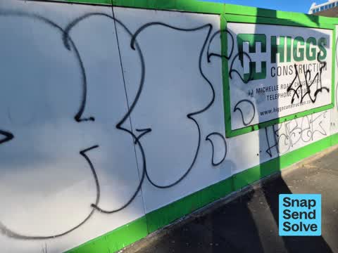 Graffiti on a fence, building or structure, a report photo