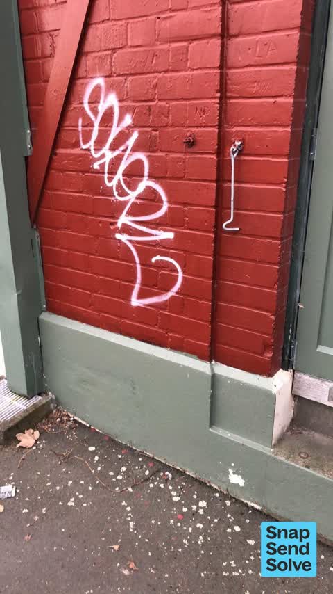Graffiti on a bus stop or public toilet, a report photo