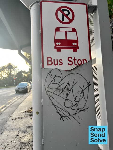 Graffiti on a bus stop or public toilet, a report photo