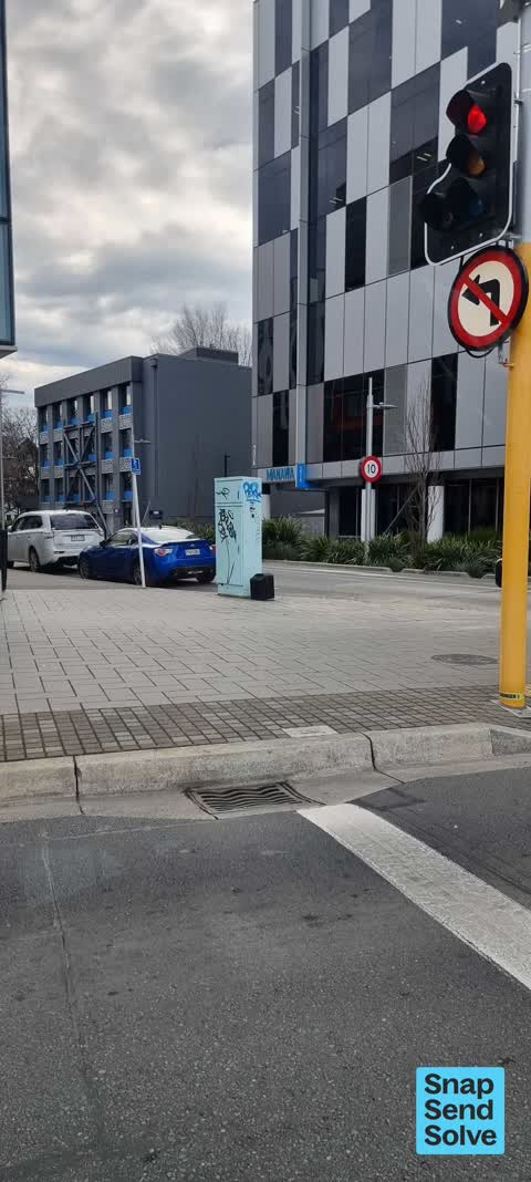 Graffiti on a traffic light pole or cabinet, or wa, a report photo